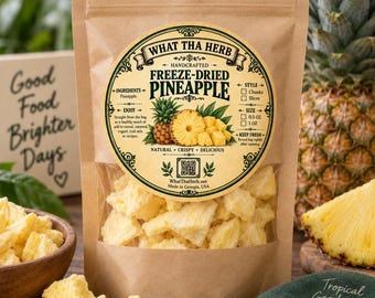 May include: A brown paper pouch containing freeze-dried pineapple chunks. The circular label features the text WHAT THA HERB, HANDCRAFTED FREEZE-DRIED PINEAPPLE, and includes a QR code, ingredient list, and checkboxes for style and size options.