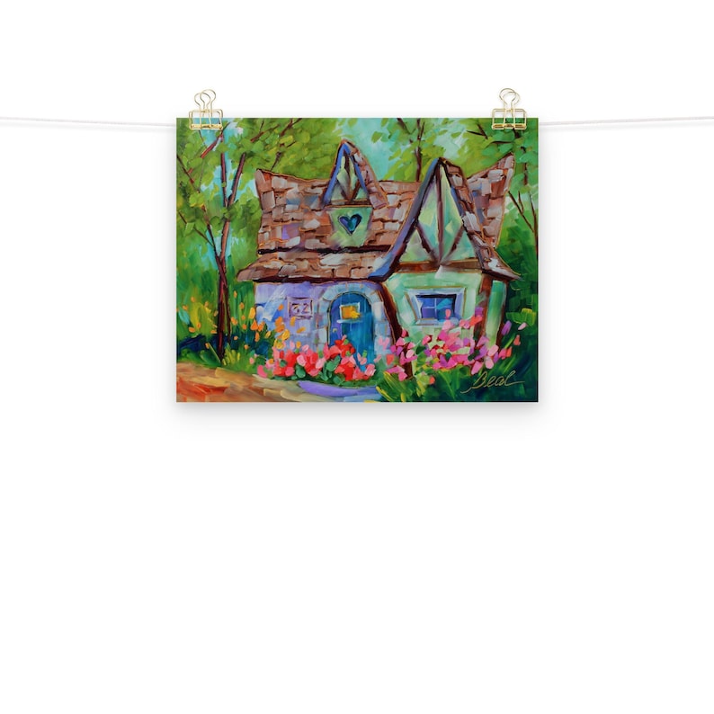 May include: A colorful painting of a whimsical cottage with a brown roof, blue door, and green trim. The cottage is surrounded by vibrant flowers and lush green trees. The artwork is signed "Beal".