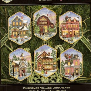 May include: A set of six hexagonal Christmas village ornaments featuring counted cross stitch designs by Brian Jackins. The kit includes cotton thread, metallic thread, 18 count ivory Aida, felt, and a needle. Each ornament is approximately 13 cm long.