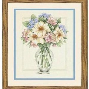 May include: A framed print featuring a watercolour-style illustration of a bouquet of white, pink, and blue flowers in a clear glass vase. The artwork is set against a cream-coloured background with a light blue border, enclosed in a wooden frame.