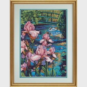 May include: Framed artwork featuring a serene pond scene with pink irises in the foreground. A green bridge arches over the water, with swans and ducklings swimming. The artwork is in a gold frame with a white mat.