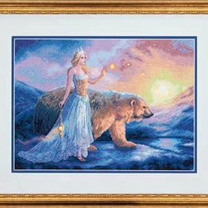 May include: Framed artwork depicting a woman in a blue gown and crown, with a polar bear, set against a sunset over a snowy landscape. The frame is gold. The woman holds a lantern.