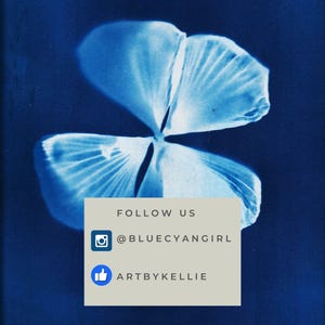May include: A cyanotype print of a four-leaf clover with a white background. The image includes the text "FOLLOW US" and social media handles "@BLUECYANGIRL" and "ARTBYKELLIE".