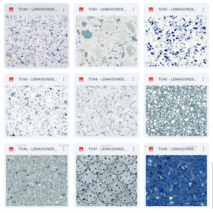 May include: Nine different terrazzo tile designs are displayed, each with a unique pattern and color scheme. The tiles feature various colors, including white, blue, gray, and green, with speckled and patterned designs. The text "TO40 - LEMAISONDE..." is visible on each tile.