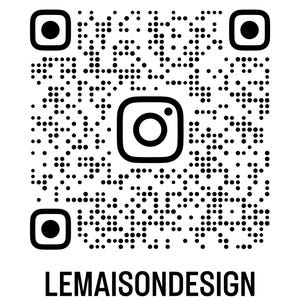 May include: A black and white QR code with the Instagram logo in the center. The text "LEMAISONDESIGN" is printed in bold, black letters at the bottom of the image. The QR code is surrounded by a white background.