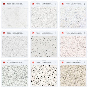 May include: Nine different samples of terrazzo tile patterns. Each tile has a unique design with varying colors and sizes of aggregate. The tiles are labeled with codes and the brand name "ALEXIA".