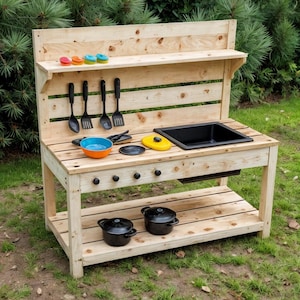 May include: A wooden outdoor play kitchen with a sink, stove, and shelf. It includes black pots, cooking utensils, and colorful play food. The natural wood finish and playful design make it a fun addition to any backyard.