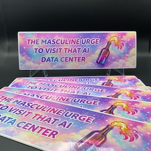 May include: Rectangular sticker with the text "THE MASCULINE URGE TO VISIT THAT AI DATA CENTER" in pink and blue. The background is a colorful sky with a bottle graphic.