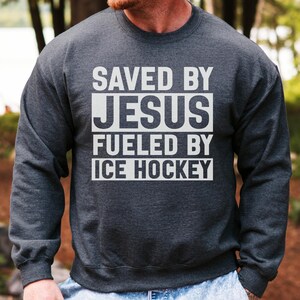 Saved By Jesus, Fueled By Ice Hockey Sweatshirt, Christian Hockey Sweatshirt, Religious Gift, Hockey Lover Gift, Hockey Fan Sweatshirt