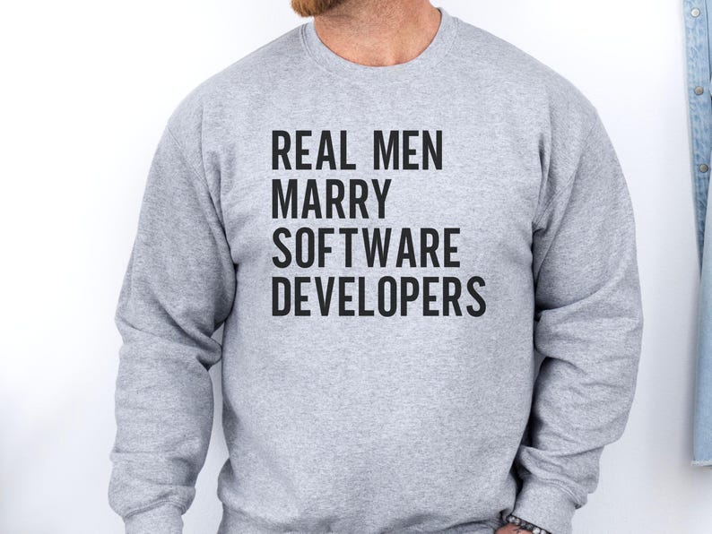 Grey sweatshirt with text "REAL MEN MARRY SOFTWARE DEVELOPERS".