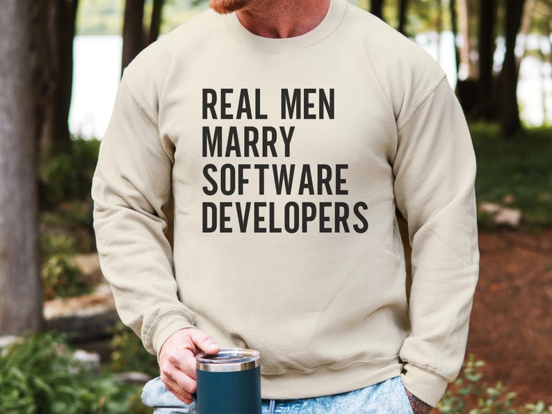Crewneck sweatshirt with text "REAL MEN MARRY SOFTWARE DEVELOPERS".