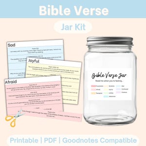 May include: A clear glass jar with a silver lid, labeled "Bible Verse Jar." The jar is surrounded by colorful cards with Bible verses and a color-coded emotion guide. The words "Bible Verse Jar Kit" are at the top.