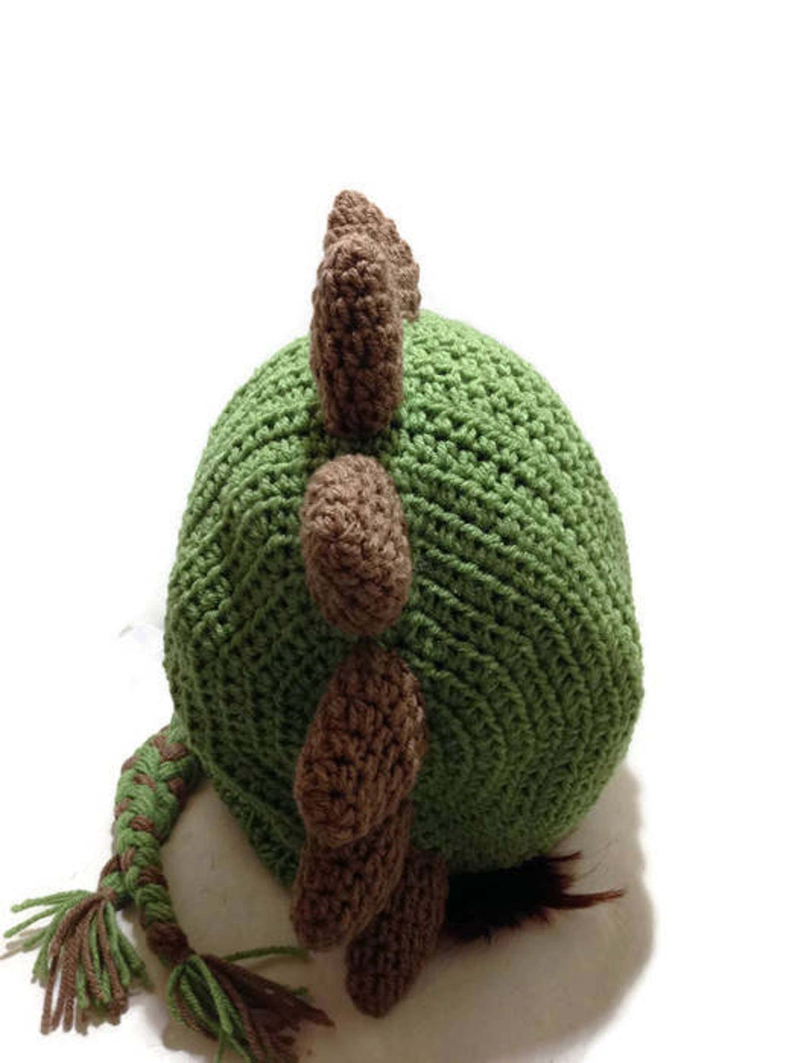 dinosaur with hood on head