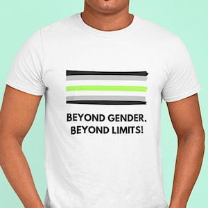 May include: White t-shirt featuring the AroAce pride flag design with black, green, gray, and white horizontal stripes. The shirt has the text "BEYOND GENDER. BEYOND LIMITS!" in black, bold font.