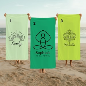 May include: Three rectangular towels in light green, medium green, and lime green. Towel 1 features a sunburst graphic and the name Emily. Towel 2 shows a yoga pose icon with the text Sophia's YOGA TOWEL. Towel 3 displays a lotus flower and the name Isabella.
