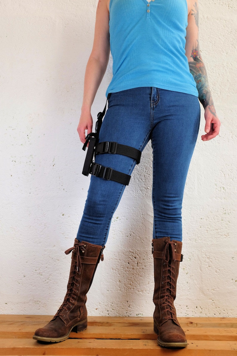 A woman wearing a Jill Valentine thigh holster by Vontoon made from durable polypropylene and strong plastic buckles