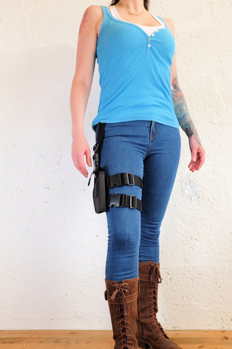 A woman wearing a Jill Valentine thigh holster by Vontoon made from durable polypropylene and strong plastic buckles