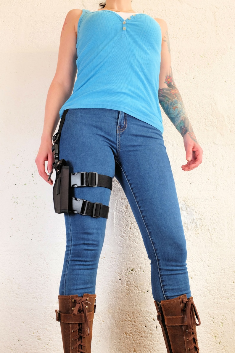 A woman wearing a Jill Valentine thigh holster by Vontoon made from durable polypropylene and strong plastic buckles