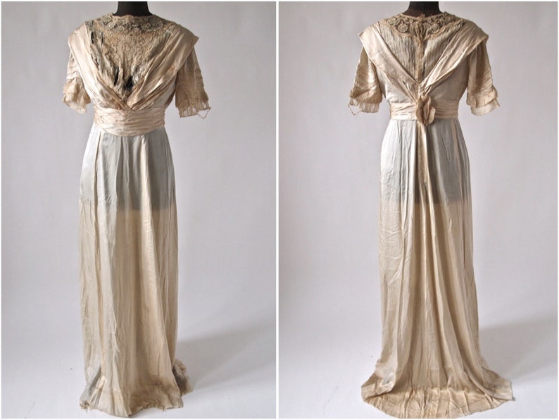 May include: A vintage ivory silk wedding dress with a lace bodice and a long flowing skirt.
