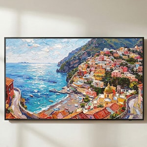 May include: A rectangular framed wall art print featuring an oil painting of a coastal Italian village with colourful buildings on a cliffside overlooking a bright blue sea, with visible thick brushstrokes and a textured impasto style appearance.