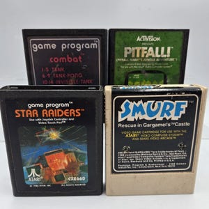 Lot Of 4 Atari 2600 VTG Video Game Cartridges Smurf Pitfall Combat Star Raiders