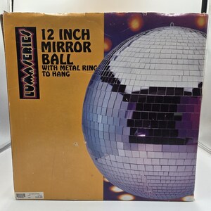 May include: A 12-inch mirror ball with a metal ring to hang, displayed in its original box. The box is a mix of orange and purple, with the product name and size prominently displayed. The disco ball is covered in small, reflective squares.