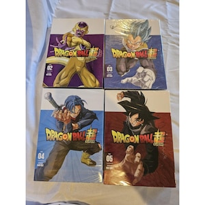 May include: Four Dragon Ball Super DVD box sets. Each box features a different character illustration with the series title in bold yellow and red. The box sets are numbered 02, 03, 04, and 05, with vibrant character art.