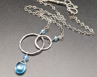 Hammered Circle Necklace with Interlocking Circles and Brilliant Swiss Blue Topaz Gemstones - December Birthstone Necklace