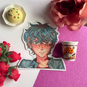 May include: An anime-style sticker of a male character with blue hair and green eyes, with the text "Dont repost". A miniature cup of instant noodles and a small plate of yellow food are also present. The image is surrounded by red roses and a pink flower.