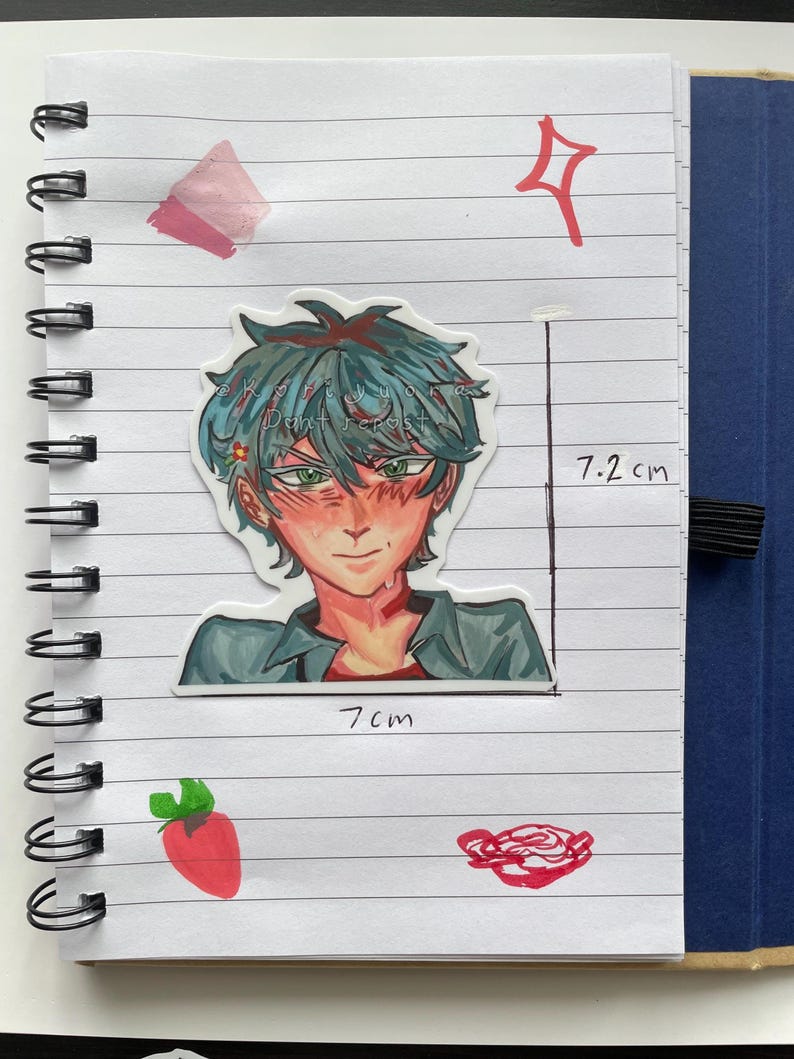 May include: A sticker of an anime-style character with teal hair and green eyes, measuring 7.2 cm tall and 7 cm wide, is placed on a lined notebook page. The character is wearing a gray shirt. Additional red and pink drawings are also on the page.