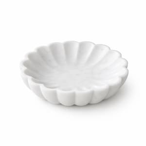May include: A white marble decorative bowl with a scalloped edge. The bowl is round and has a shallow interior. The marble has a smooth, polished finish. The bowl is suitable for holding small items.
