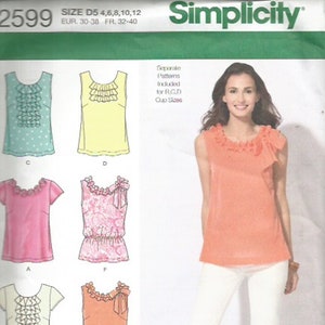 May include: Simplicity sewing pattern featuring various top designs with ruffle and bow details. The image includes a woman wearing a coral-colored top and white pants. The pattern sizes are D5 4,6,8,10,12.