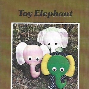 May include: A vintage sewing pattern titled "Toy Elephant" featuring three colorful stuffed elephants. The elephants are pink, white, and green with yellow accents. The pattern includes instructions for creating the toy elephants.