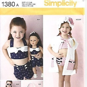 May include: Simplicity sewing pattern 1380 features children's swimwear and accessories. The designs include a nautical-themed bikini and shorts set, a matching doll outfit, and a beach cover-up. The pattern also includes a tote bag and sandals.