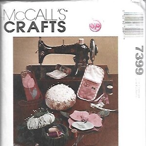 May include: A McCall's Crafts pattern cover featuring a sewing machine and various sewing accessories. The image includes a needlecase, sewing pouch, and other items. Text on the cover reads "Sew Organized".