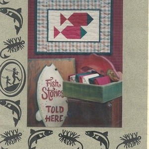 May include: A vintage print featuring the text "Spawning Sockeyes." The image includes a quilt with fish designs, a sign that reads "Fish Stories Told Here," and decorative fish and fishing fly silhouettes. Copyright 1994 Debbie Caffrey.