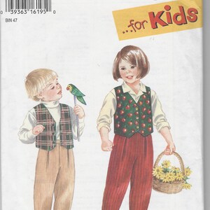 May include: A Simplicity sewing pattern envelope, number 9266, size A for kids. The front shows illustrations of two outfits: a plaid vest with tan trousers and a green apple-print vest with red trousers, including text: It's SO EASY it's Simplicity for Kids.