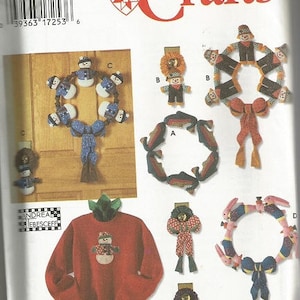 May include: Simplicity Crafts pattern featuring various handmade holiday decorations. Includes snowman and bunny wreaths, a snowman-themed sweatshirt, and other festive ornaments. The pattern is one size.