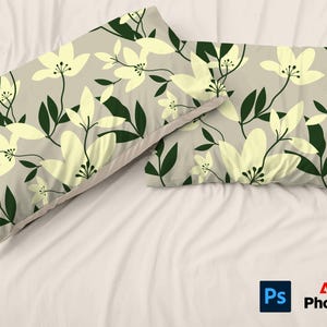 May include: Two pillowcases with a floral pattern. The pillowcases are beige with yellow flowers and dark green leaves.