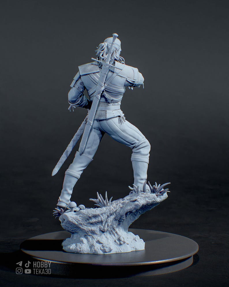 May include: A light gray resin figurine of a warrior standing on a textured base with small mushrooms. The figure has long hair, wears detailed armor, and carries a long sword strapped to the back. The text HOBBY TEKA3D is visible at the bottom.