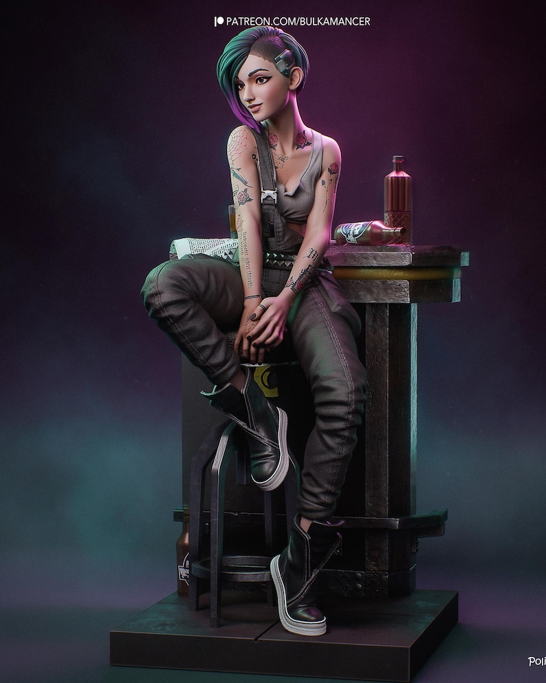 May include: A stylized 3D figurine of a person with short teal and black hair, wearing a grey tank top, dark grey overalls, and black high-top sneakers. The figure features visible arm tattoos, sits on a stool, and includes text PATREON.COM/BULKAMANCER.