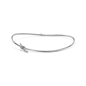 May include: A silver necklace featuring a knot design. The necklace has a thin, curved band that connects at the back with a clasp. The knot is embellished with small, sparkling stones, adding a touch of elegance to the jewellery.