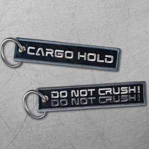 Cyberpunk Cargo Hold Keychain: Embroidered &quot;Remove Before Flight&quot; Tag