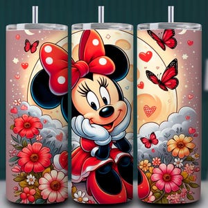 May include: Three stainless steel tumblers featuring a cartoon Minnie Mouse design. The design includes Minnie Mouse in a red dress and bow, butterflies, flowers, and a moon background. The tumblers are decorated with a pink background.