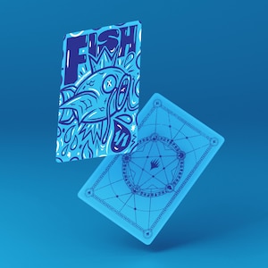 May include: Two blue playing cards with a fish illustration and the word "FISH" in white. The back of the card has a geometric design. The cards are floating against a blue background.