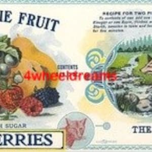 May include: Vintage fruit label featuring a colorful illustration of various fruits, including berries, plums, and a peach. The label reads "Delicious Pie Fruit" and "Elderberries." A separate panel depicts a fox running through a stream. The label is from The Ohio Canning Co.