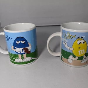 Vintage- Lot of 2 - Galerie M&M Coffee Mug - Blue / Red and Yellow / Red