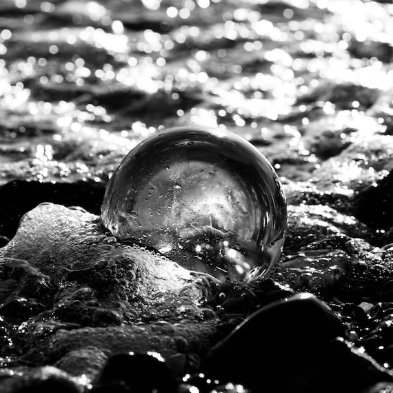 Monochrome Glass Sphere Hit by Ocean Waves - Print