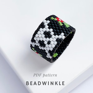 May include: A wide, beaded ring with a geometric pattern. The ring has a black base with white, green, and red accents. The text "PDF pattern" and "BEADWINKLE" are visible below the ring.