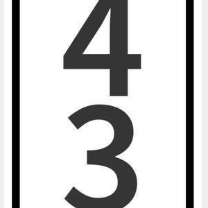 May include: A rectangular white sign with a black border displays the number sequence 94333 in a bold, sans-serif font. The numbers are centered vertically and take up most of the sign's surface.